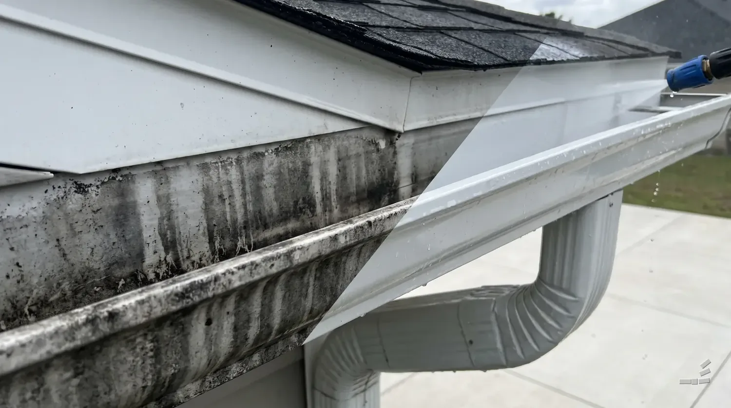 Photograph-style white gutter half cleaned of tiger stripes